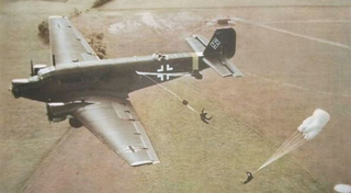German paratroopers jump from a Ju 52 during the Battle of Crete